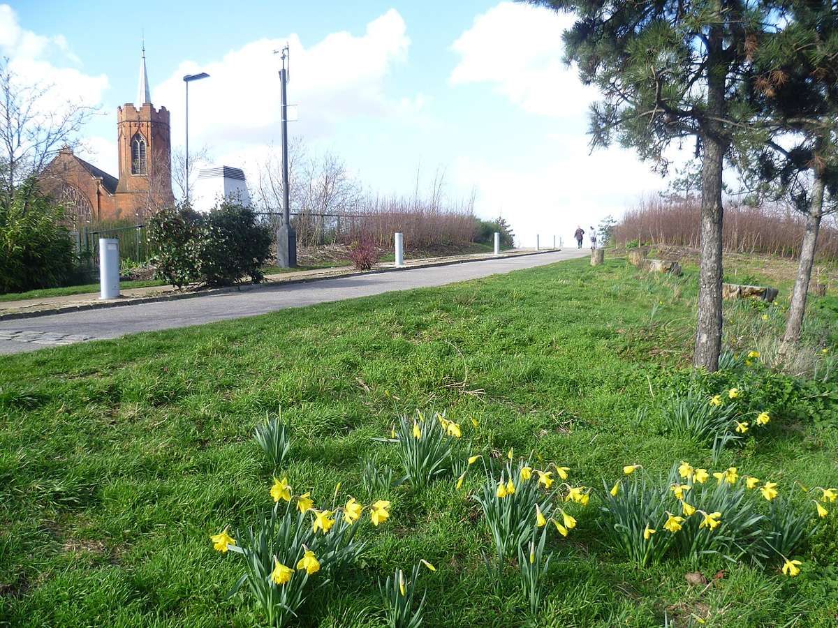 Mile End Park, a 32-hectare linear park beside the Regent's Canal, with a green bridge over Mile End Road