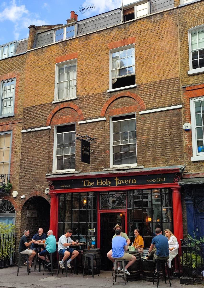 The Holy Tavern, a candlelit pub on Britton Street in Clerkenwell, set in a building